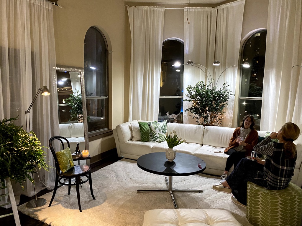 Full room view showing how plants and furniture coexist as architectural equals
