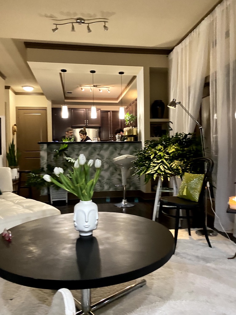 Daytime room shot with airy natural light and botanical abundance