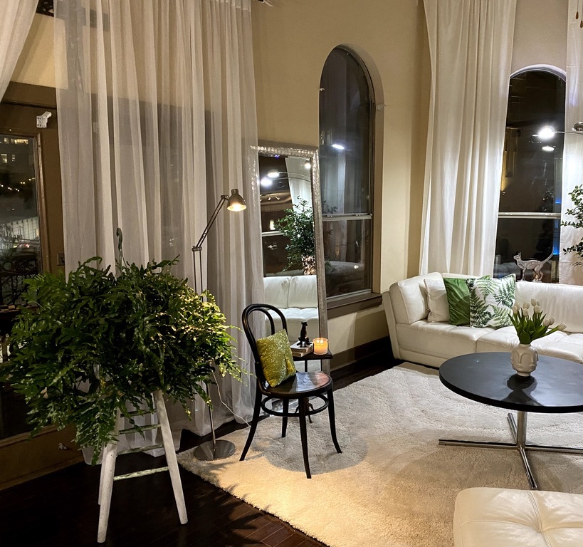 Murillo Interiors project space with rich layering and warm ambient light